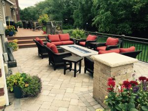 full brick patio with bricked in fireplace and patio furniture surrounding  thumbnail image