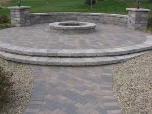 Finished brick walkway leading to a stone firepit  thumbnail image