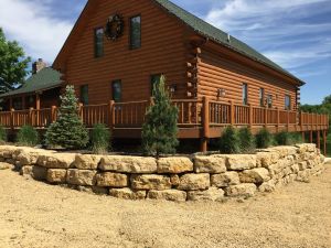 Accent wall in front of a log cabin house  thumbnail image