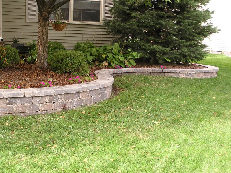 Retaining wall on fresh landscaping